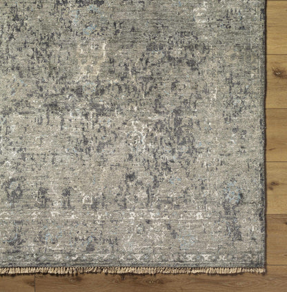 Becerril Premium Rug from Boutique Rugs, distressed gray pattern with fringe edge on Tampa Home & Garden Store