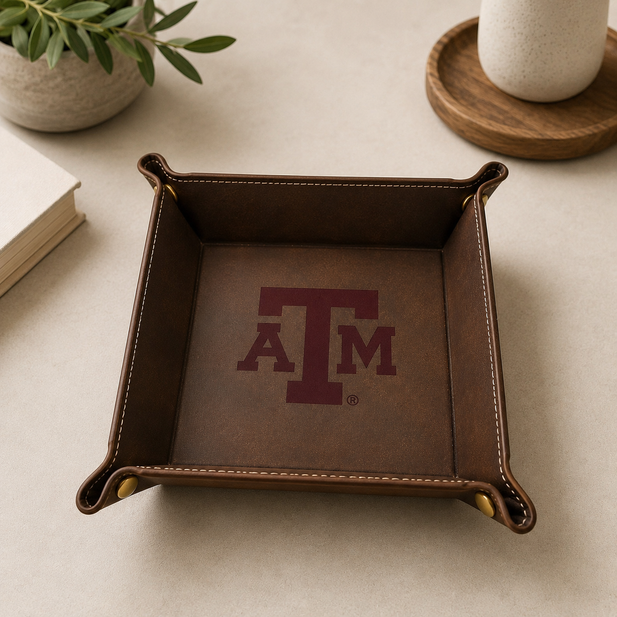 Texas A&M maroon leather catchall tray with TAM logo, brown leather with brass rivets on Tampa Home & Garden Store