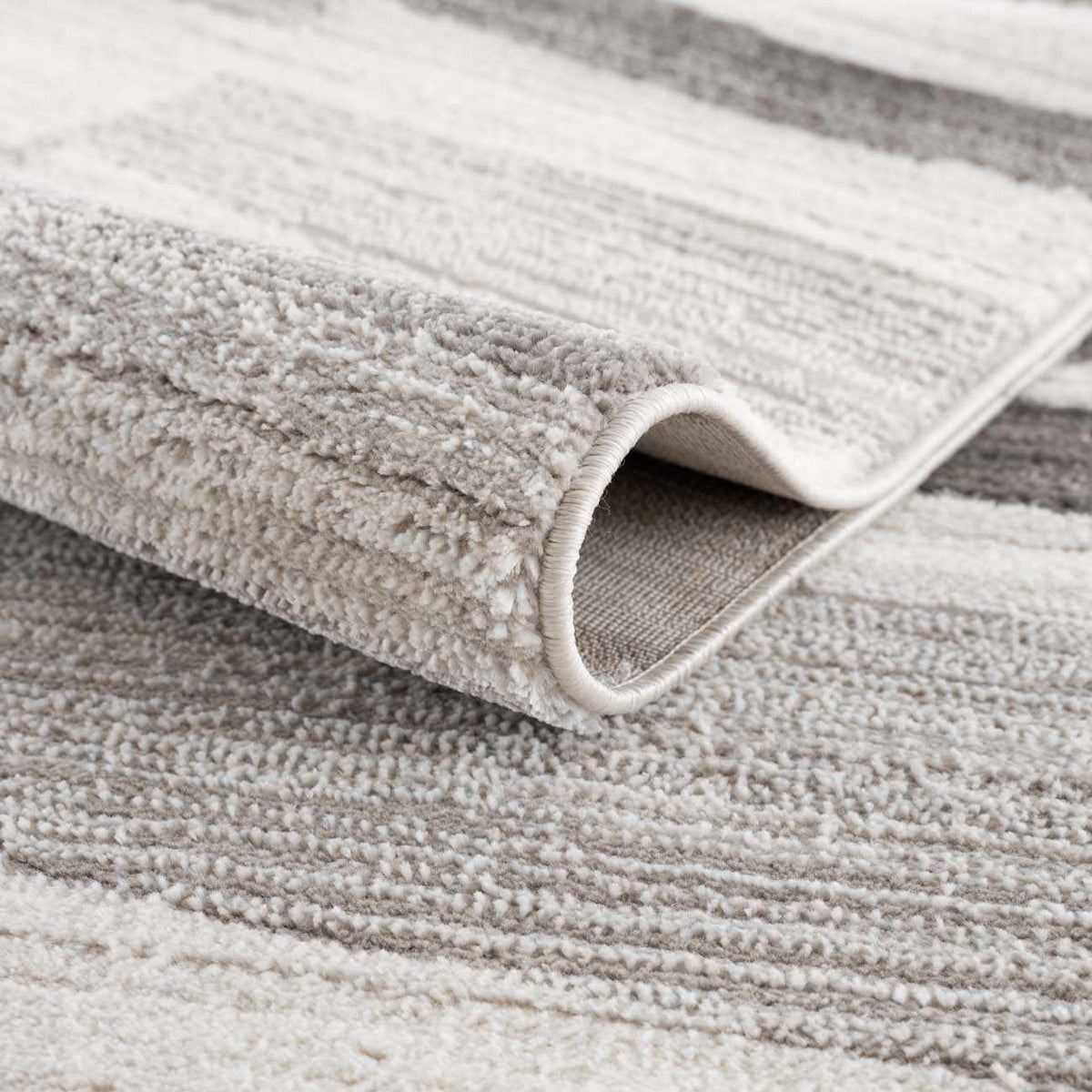 Rug Bojana broken-striped area rug with plush boucle pile in beige-gray Boutique Rugs on Tampa Home & Garden Store