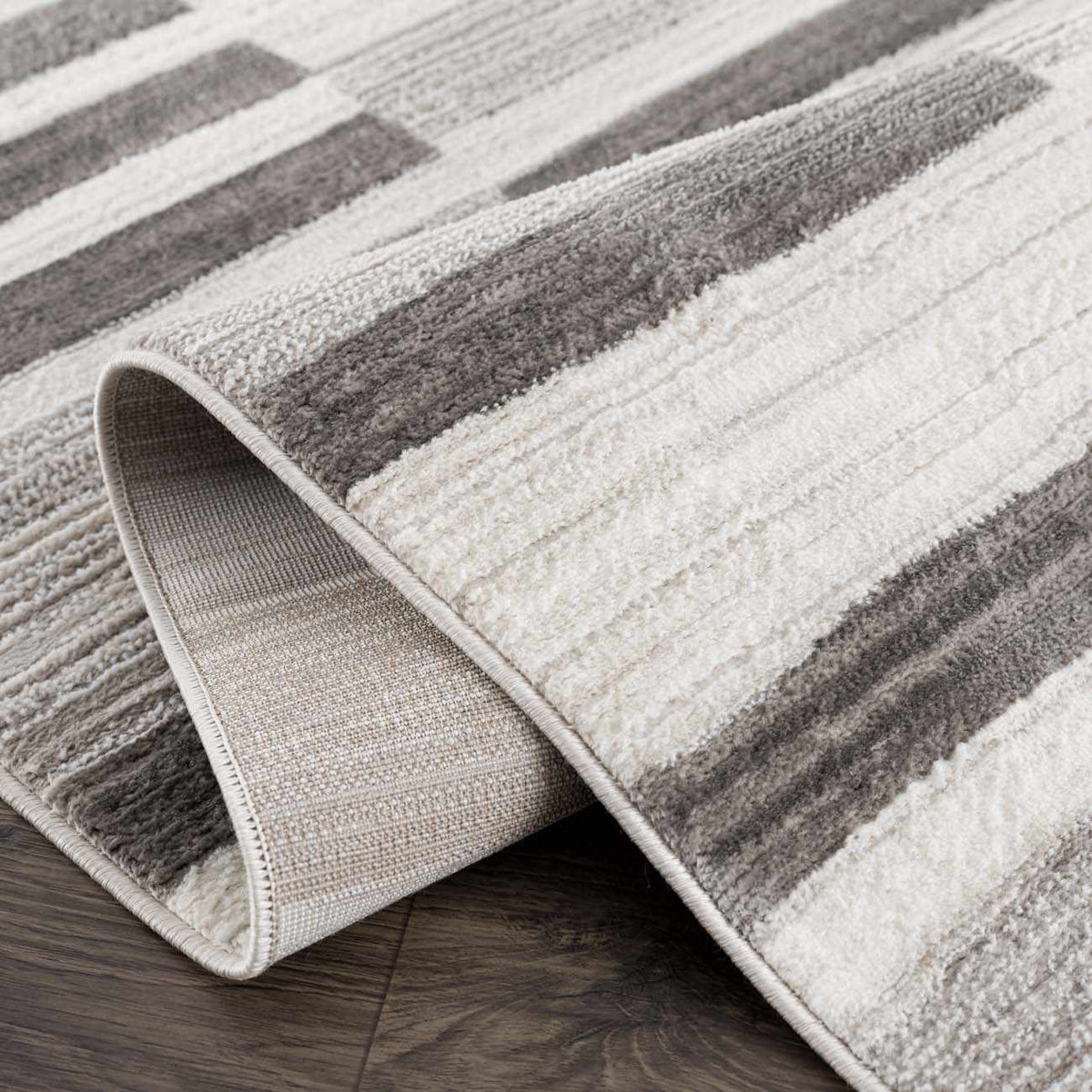 Bojana broken-striped area rug in cream and gray tones by Boutique Rugs on Tampa Home & Garden Store