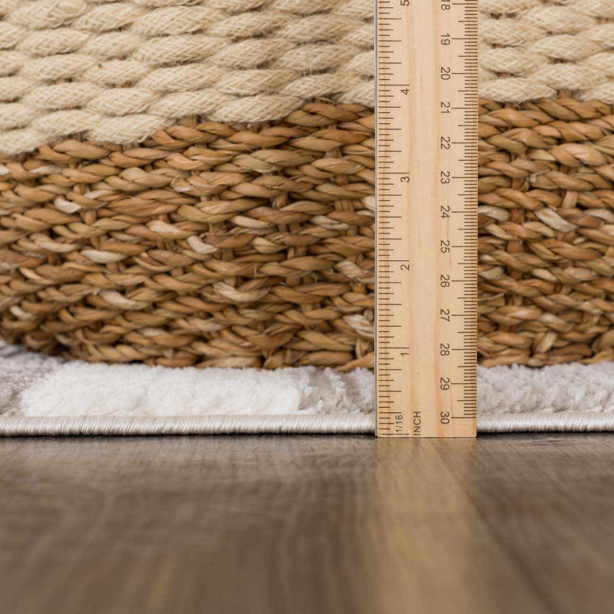 Bojana broken-striped area rug close-up of natural jute fibers with fringe and ruler on Tampa Home & Garden Store