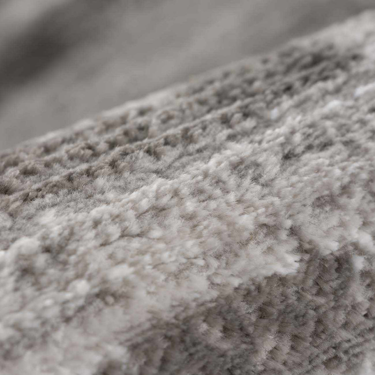 Bojana broken-striped area rug close-up in neutral gray beige by Boutique Rugs on Tampa Home & Garden Store