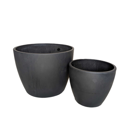 Black eco plant pots from Rooted Treasures Farms in two sizes on Tampa Home & Garden Store