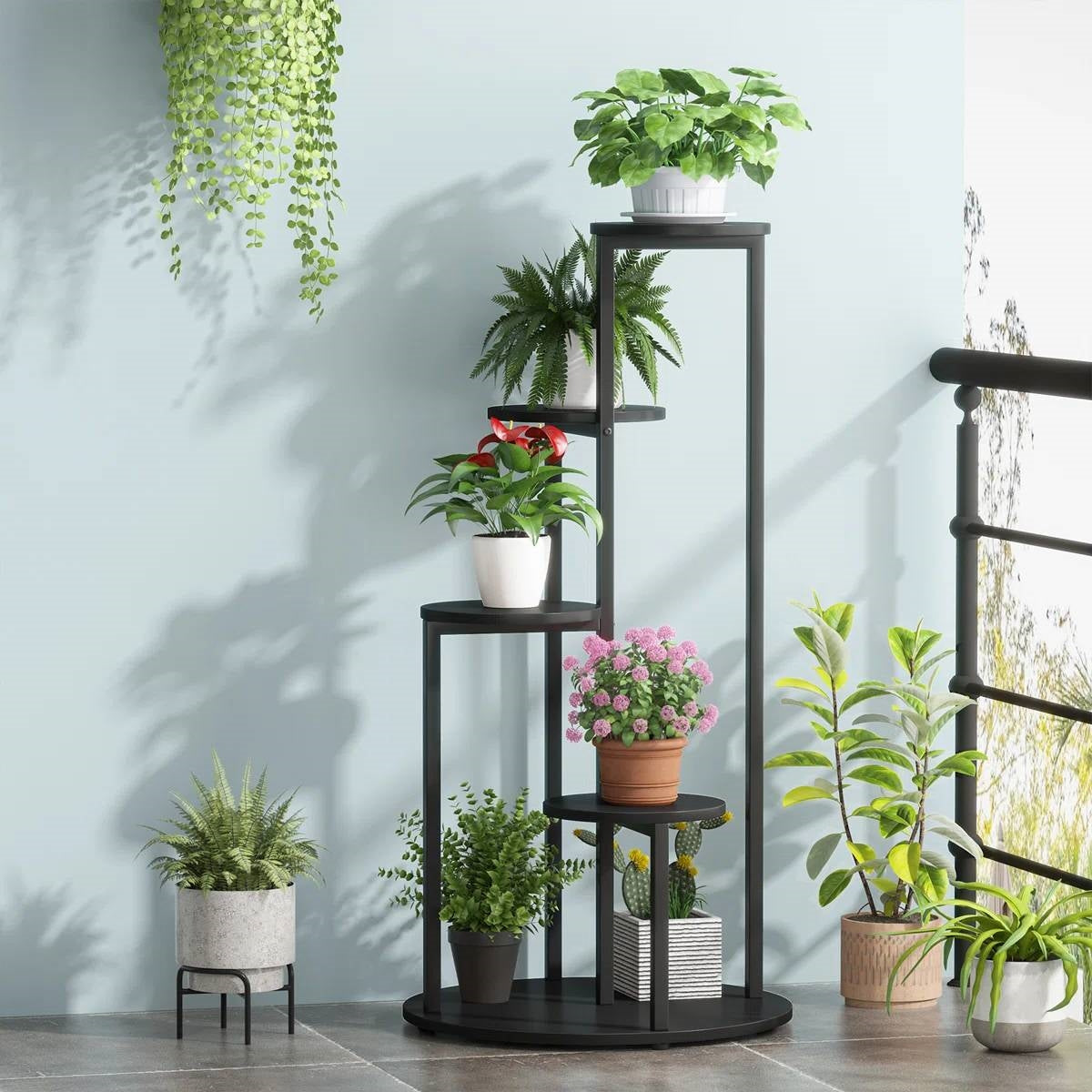 Modern 5-Tier Indoor Plant Stand in Black with several potted plants on its shelves on Tampa Home & Garden Store