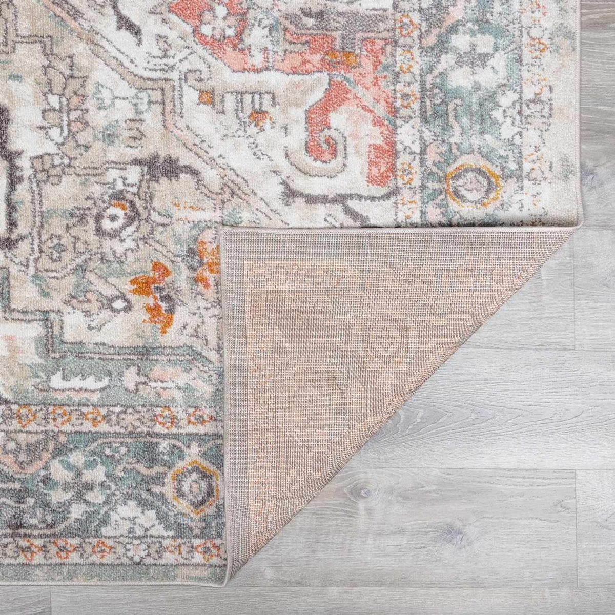 Bolinas area rug by Boutique Rugs, ornate medallion pattern in ivory, teal, coral on Tampa Home & Garden Store