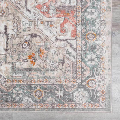 Bolinas Area Rug by Boutique Rugs, cream field with teal and coral accents and ornate border on Tampa Home & Garden Store
