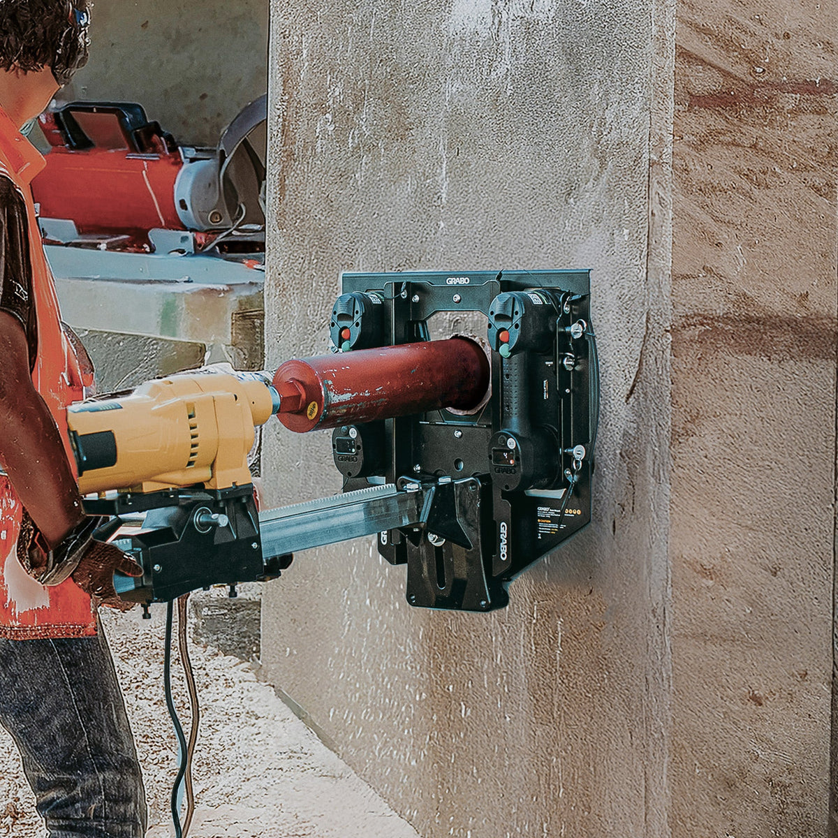 GRABO Bore Mount Core Drill Holder, Two-Cup teal suction mount attached to concrete wall on Tampa Home & Garden Store