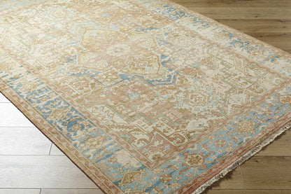 Bangonay Area Rug by Boutique Rugs in soft beige with blue and peach accents fringed edges on Tampa Home & Garden Store