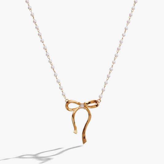 Bow Pearl Coquette Necklace by ALEX AND ANI with a gold-tone bow pendant and pearl chain on Tampa Home & Garden Store