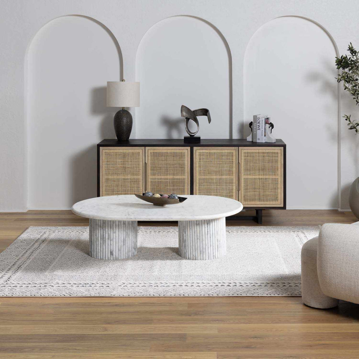 Burdette Soft Neutral Rug by Boutique Rugs in light beige under a coffee table on Tampa Home & Garden Store
