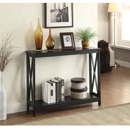 Black wood console sofa table with bottom shelf and X-leg frame; two amber vases top on Tampa Home & Garden Store