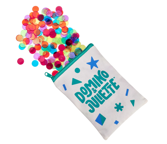 Counting chips in assorted translucent colors spilling from a teal zip pouch, Domino & Juliette on Tampa Home & Garden Store