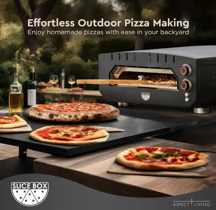 Slice Box Outdoor Electric Pizza Oven by Fire Sense, black metal outdoor oven with pizzas on a backyard table on Tampa Home & Garden Store