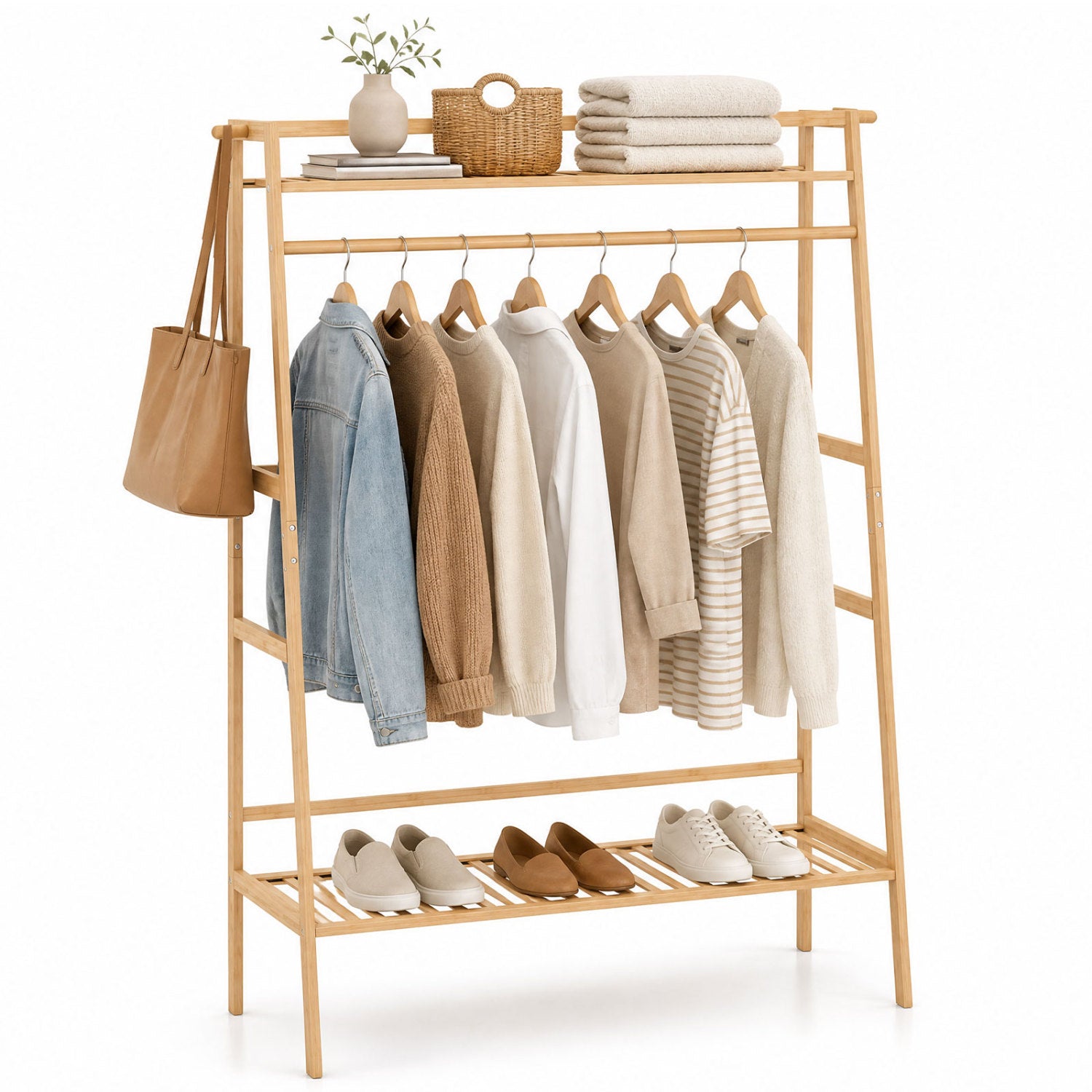 Bamboo garment rack with shelves and rod, coats on hangers, tote on side and shoes below on Tampa Home & Garden Store
