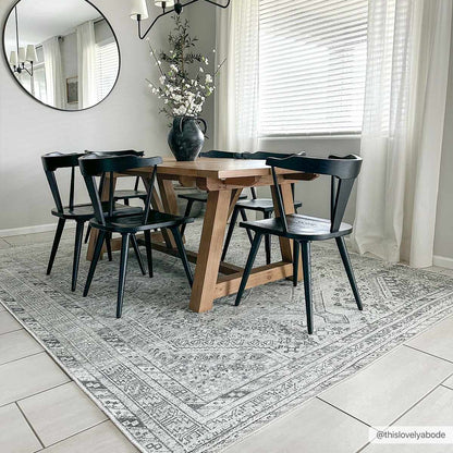 Barny Sage flat-pile washable rug by Boutique Rugs in light gray under dining table on Tampa Home & Garden Store