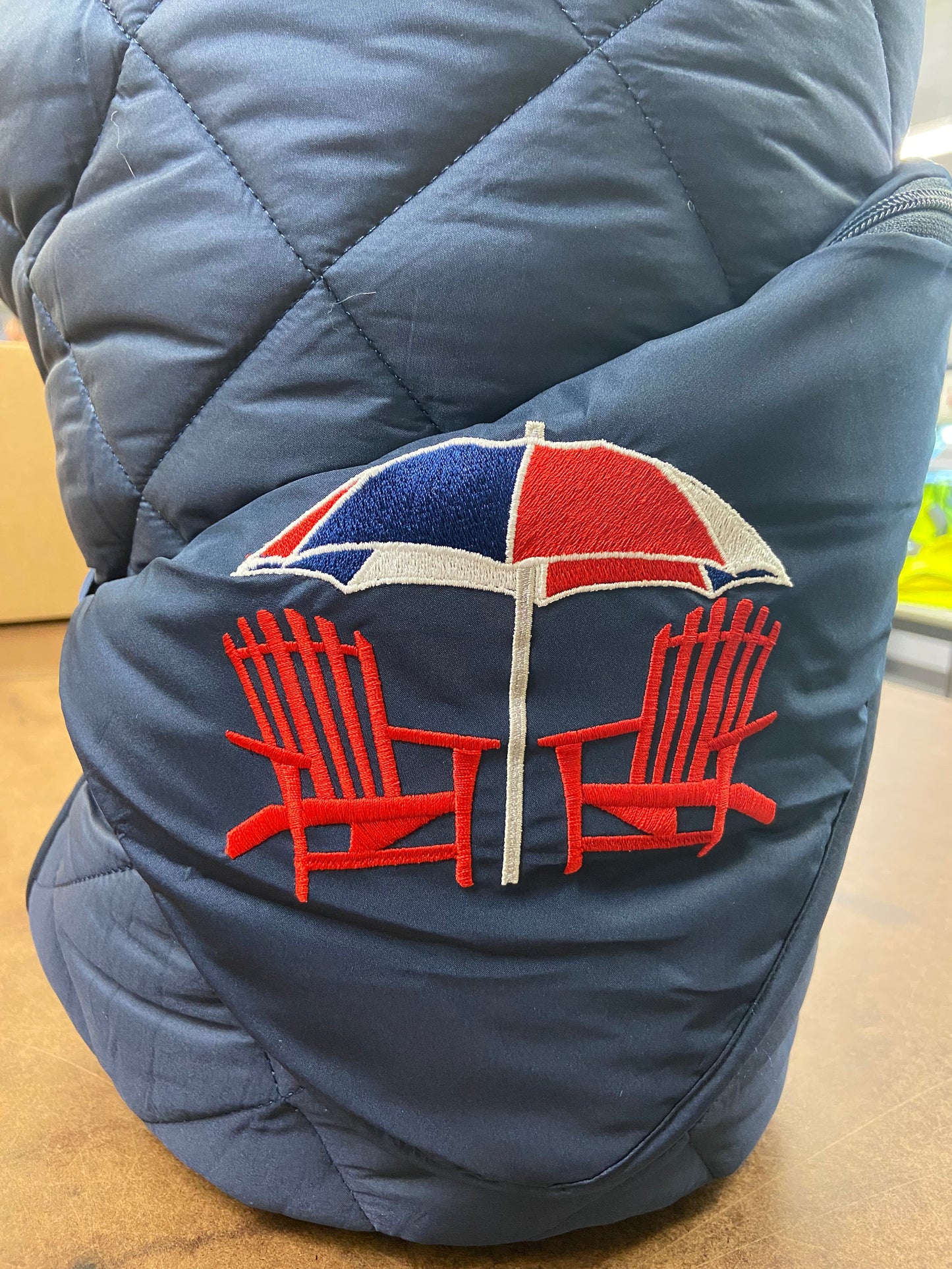 Beach Day on Navy Puffer Blanket featuring a bold red embroidered patch on Tampa Home & Garden Store
