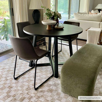 Benjy Irregular Checkboard Rug Boutique Rugs Cream&Gold under a black round dining table on Tampa Home & Garden Store