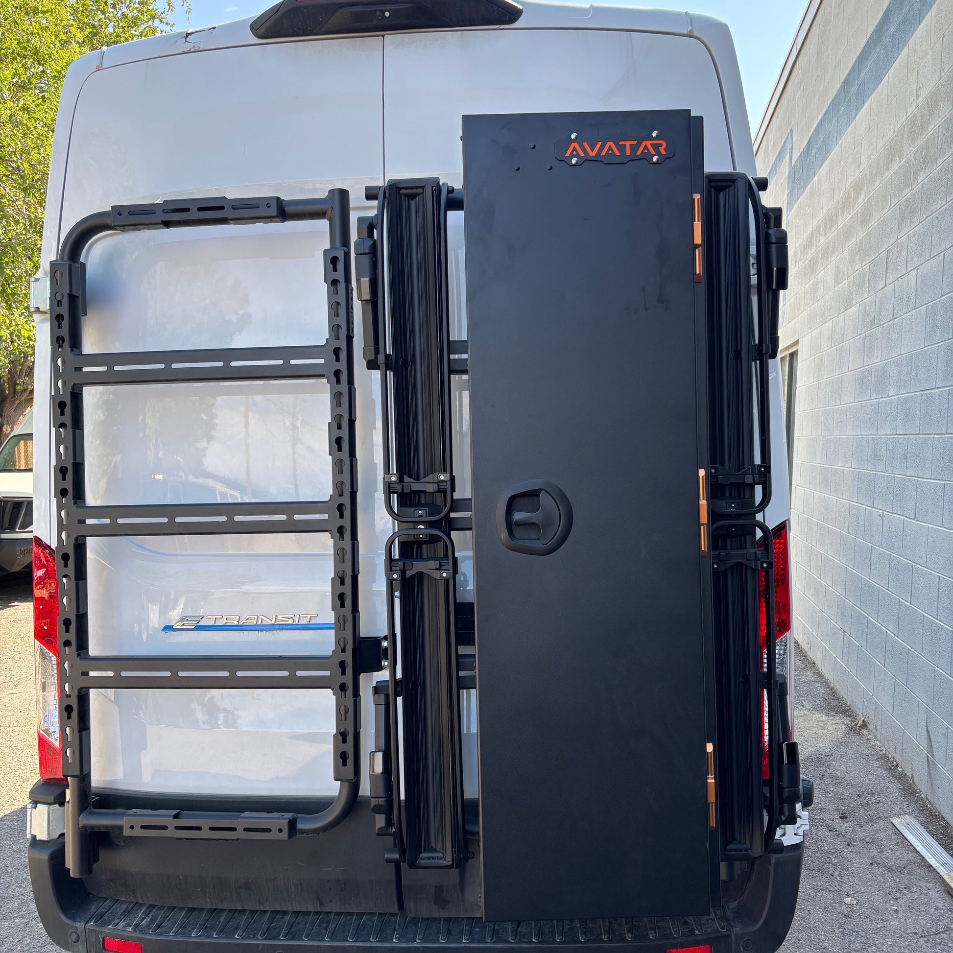 Avatar Centi Van Storage Box mounted on a black rack at rear of white van with Avatar logo on Tampa Home & Garden Store
