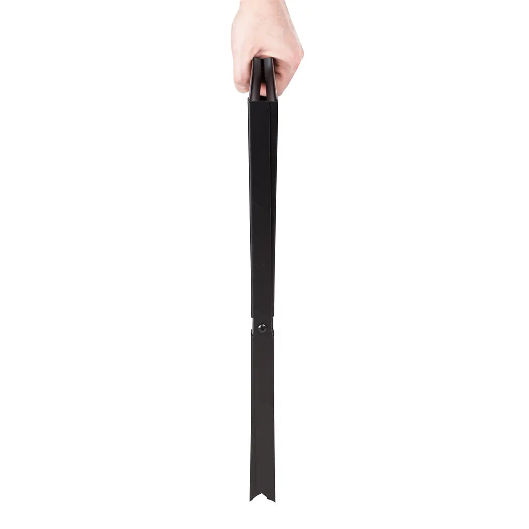 Black Notebook Charcoal Grill long slim black metal panel held by hand on Tampa Home & Garden Store