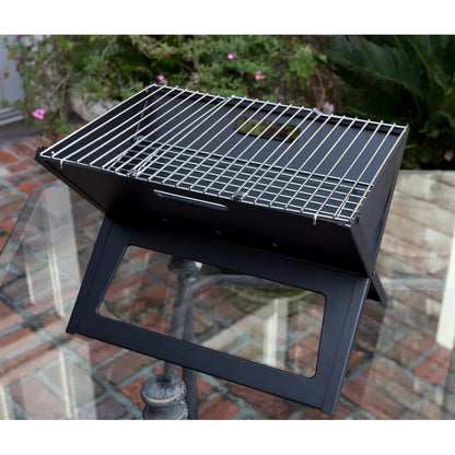 Black charcoal grill on a metal stand with chrome cooking grate on Tampa Home & Garden Store