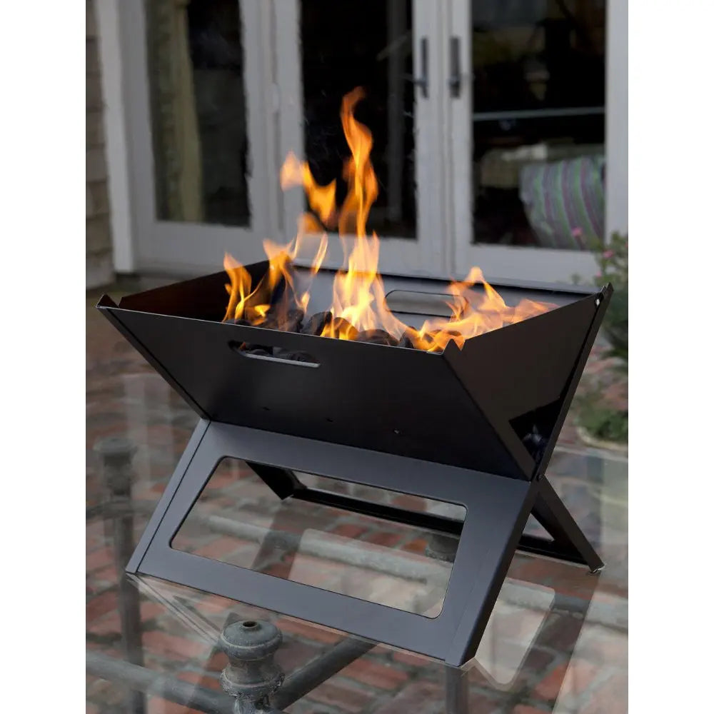Black Notebook Charcoal Grill on steel X-frame stand with flames by Fire Sense/Balkene Home on Tampa Home & Garden Store