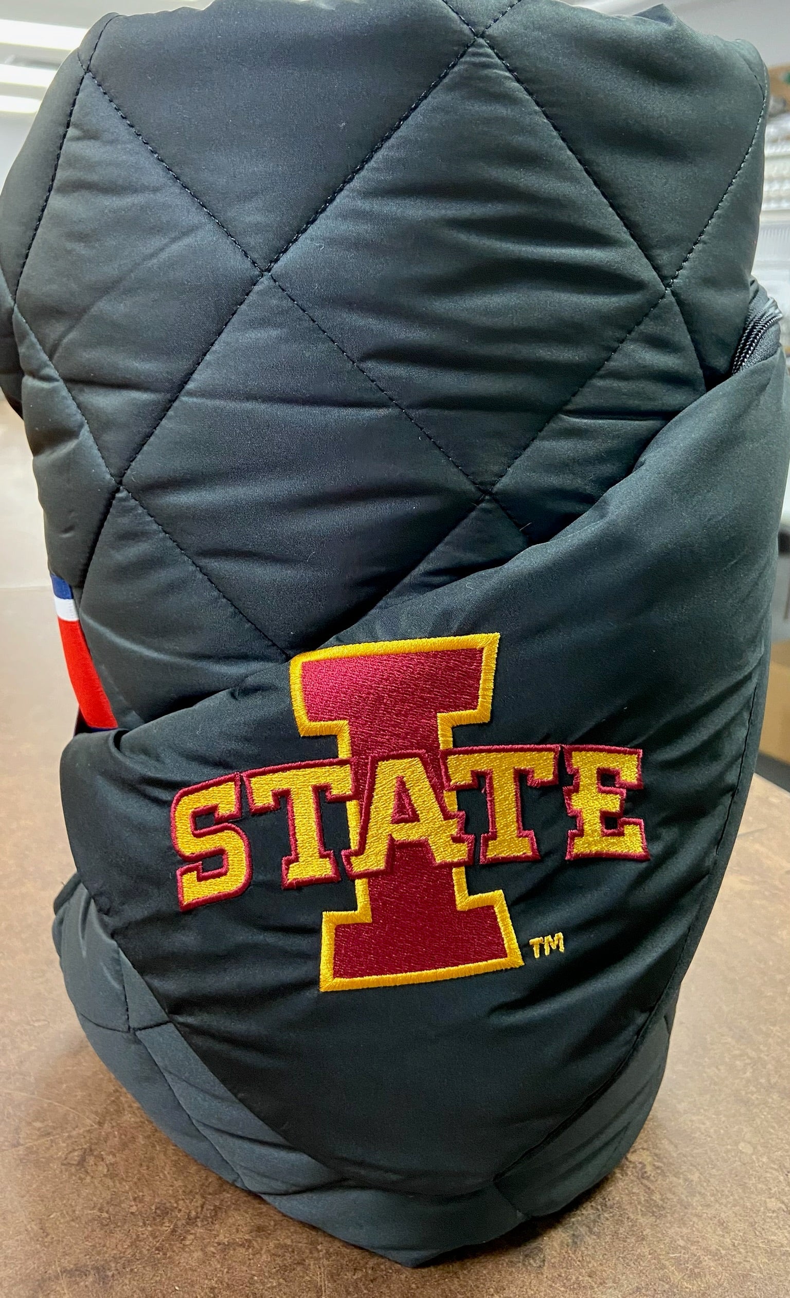 Iowa State black quilted puffer blanket with red-gold logo embroidery by Pretty Rugged on Tampa Home & Garden Store