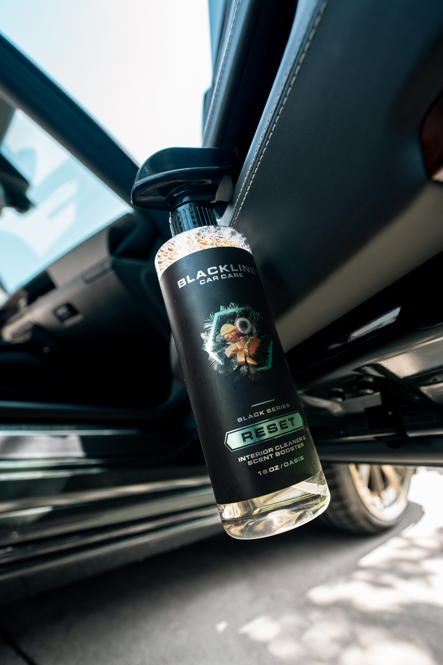 Blackline Car Care RESET interior cleaner scent booster bottle in black mounted in car on Tampa Home & Garden Store