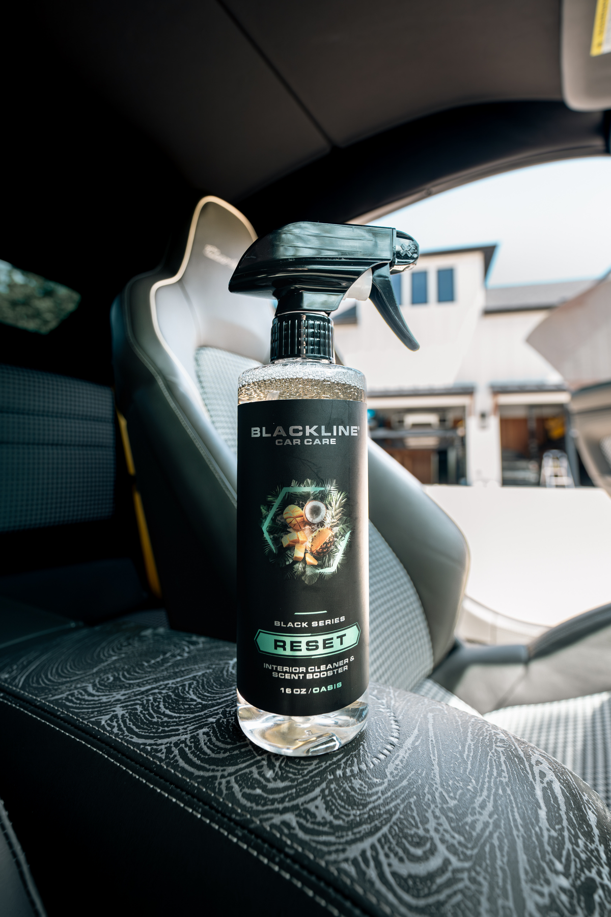 Blackline Car Care RESET interior cleaner & scent booster spray bottle in car interior on Tampa Home & Garden Store