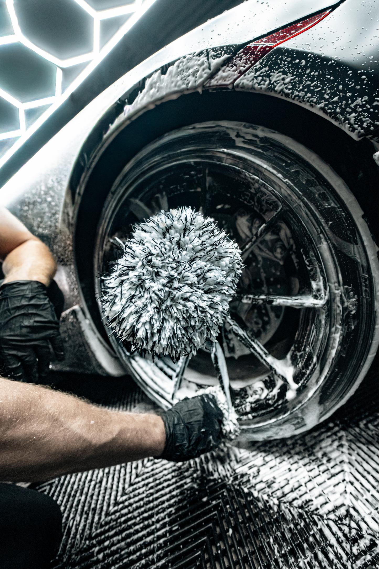 Blackline Car Care Microfiber Wheel Mitt with grey fibers used on a soapy wheel on Tampa Home & Garden Store
