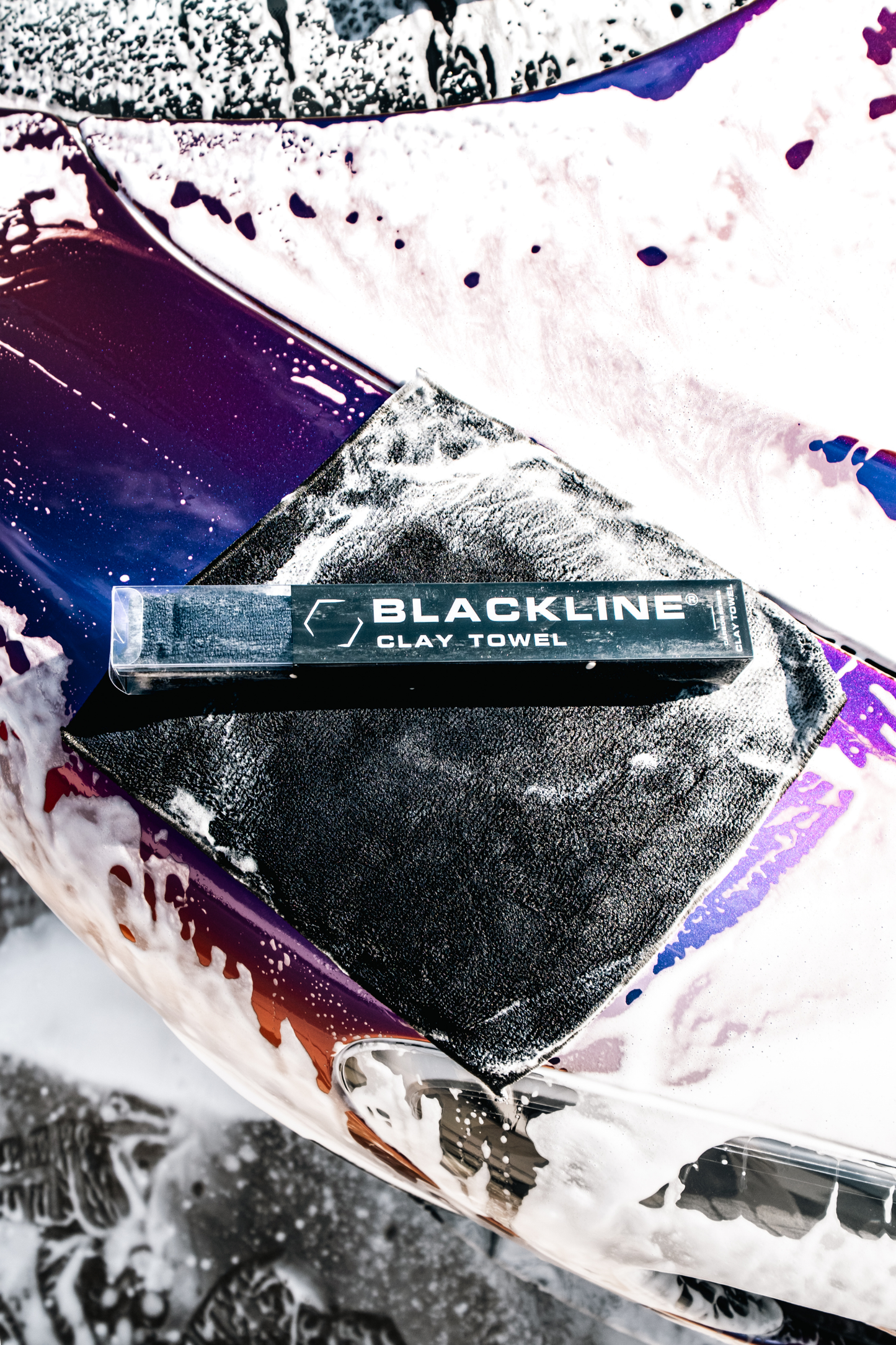 Blackline Clay Towel packaging for car wash brush on a soapy purple car surface on Tampa Home & Garden Store