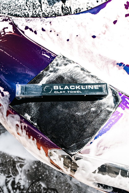 Blackline Clay Towel packaging for car wash brush on a soapy purple car surface on Tampa Home & Garden Store
