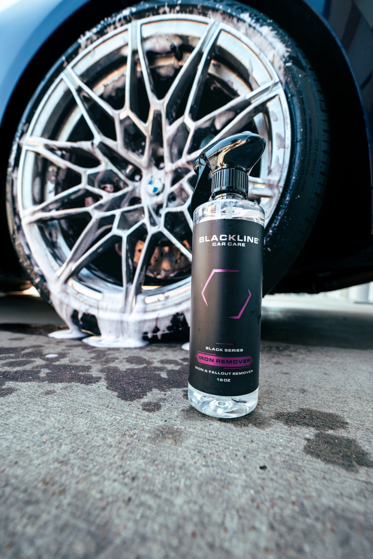 Blackline Iron Remover spray bottle with black label beside a foamy alloy wheel on Tampa Home & Garden Store