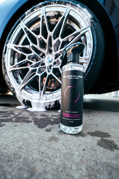 Blackline Iron Remover spray bottle with black label beside a foamy alloy wheel on Tampa Home & Garden Store