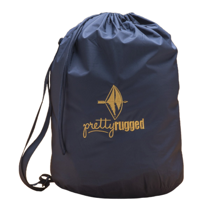 Villanova Large Blue Outdoor Blanket in navy drawstring bag with Pretty Rugged logo on Tampa Home & Garden Store
