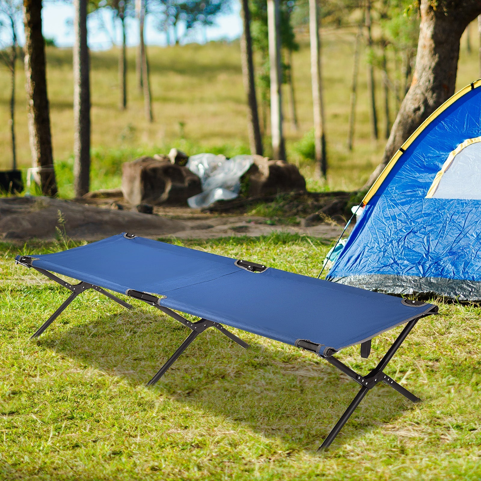 GemGear Adults Kids Folding Camping Cot with blue fabric and black metal frame in a campsite on Tampa Home & Garden Store