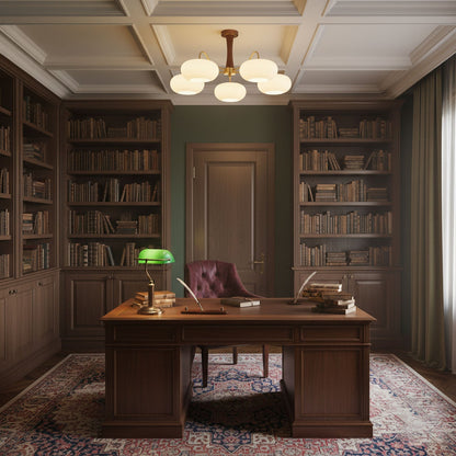 Persimmon Glass Chandelier with Brass Arms by Moktan Sabai above a desk in a dark wood library on Tampa Home & Garden Store