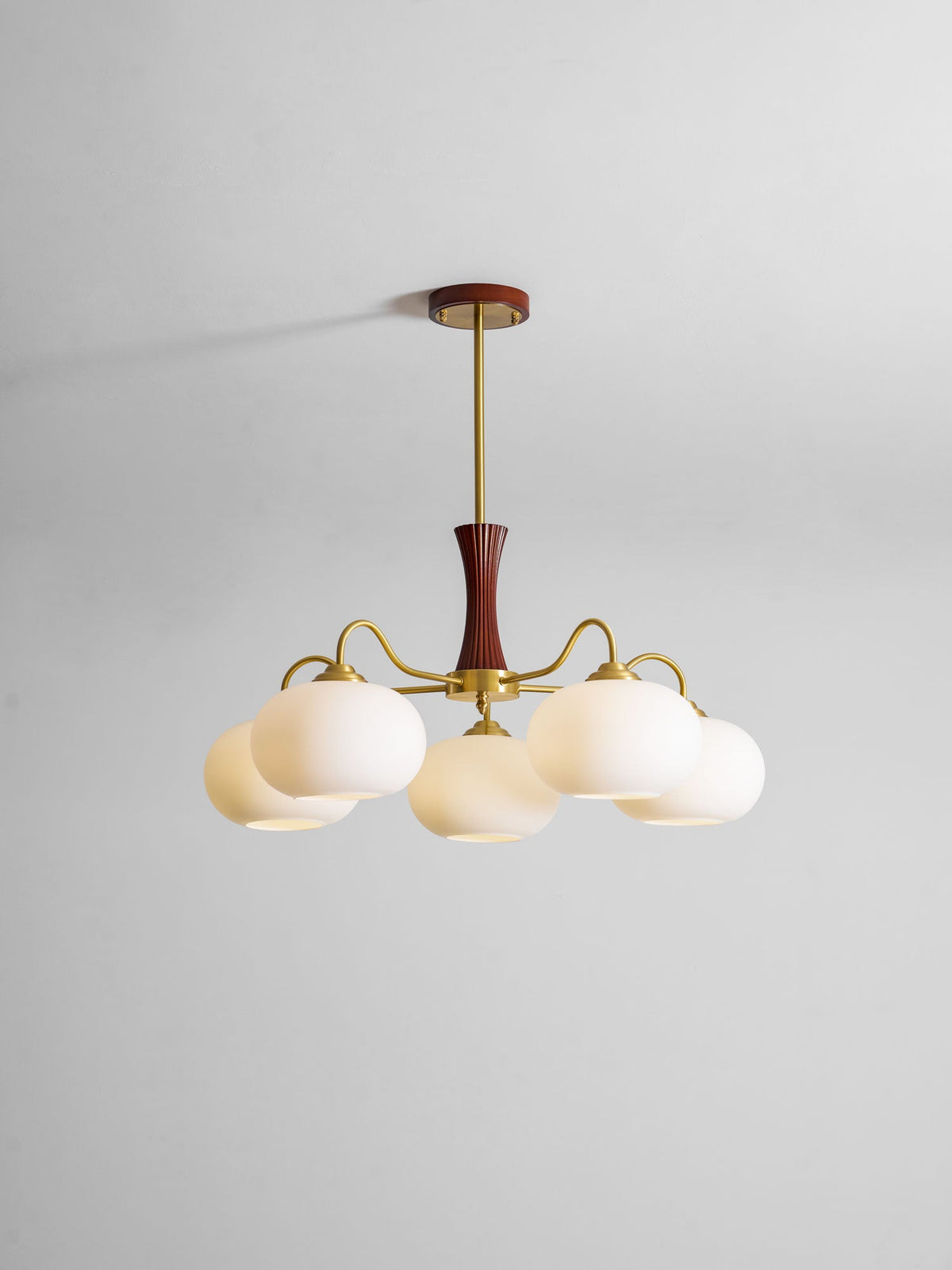 Persimmon glass chandelier with brass arms and wood accent by Moktan Sabai on Tampa Home & Garden Store