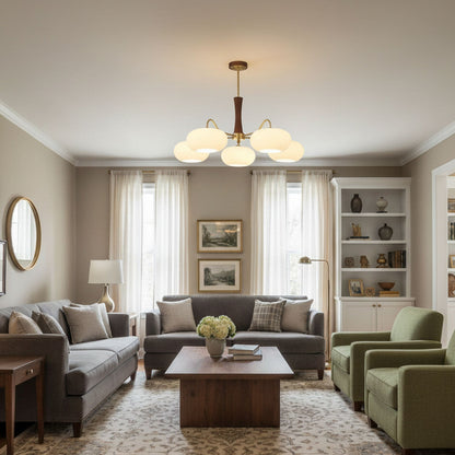 Persimmon glass chandelier with brass arms and wood accents in living room on Tampa Home & Garden Store