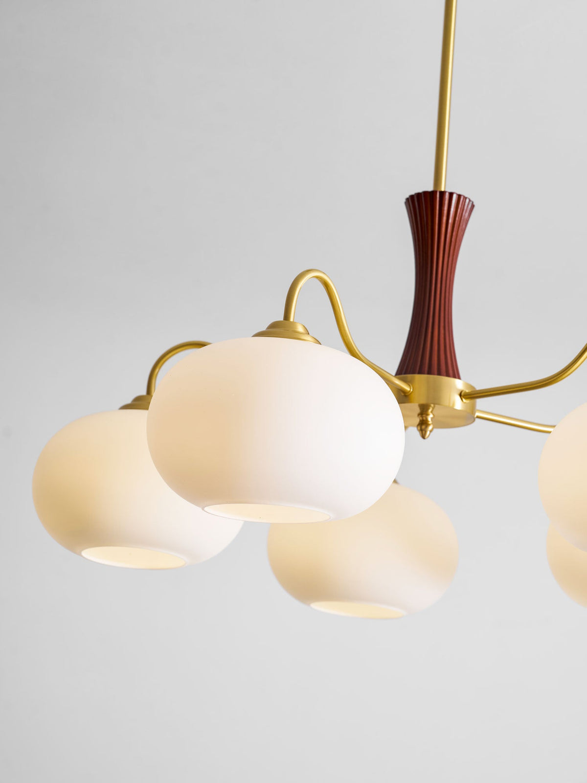 Persimmon glass chandelier with brass arms and wood accent, multi-light frosted globes on Tampa Home & Garden Store