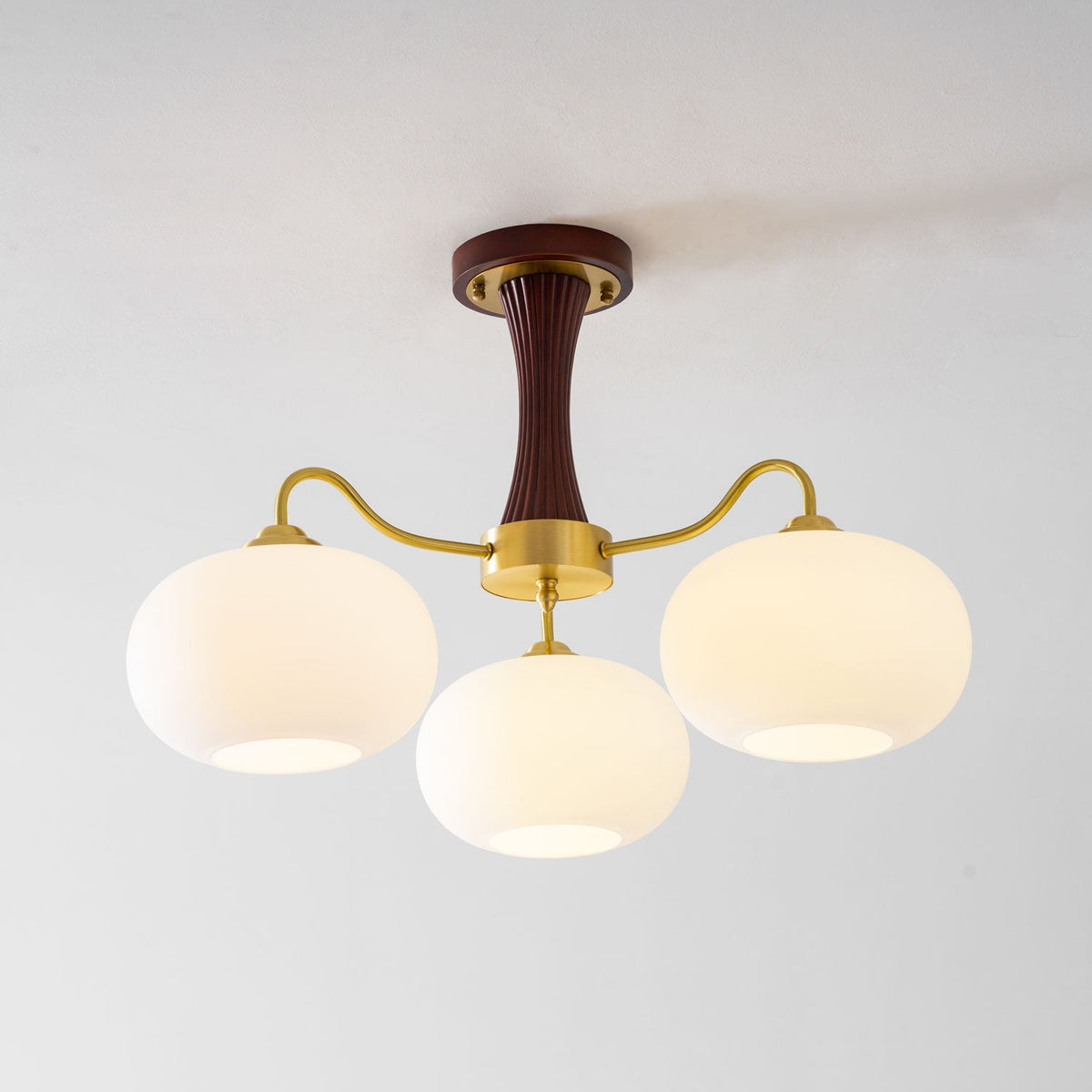 Persimmon Glass Chandelier with Brass Arms and wood accent stem, four frosted glass globes on Tampa Home & Garden Store