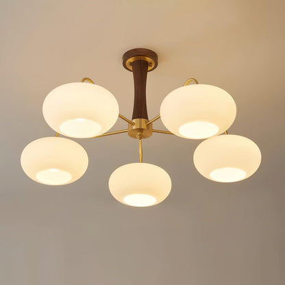 Persimmon glass chandelier with brass arms and wood accent central column on Tampa Home & Garden Store