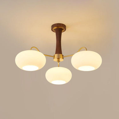 Persimmon glass chandelier with wood accent and brass arms Moktan Sabai three-globe on Tampa Home & Garden Store