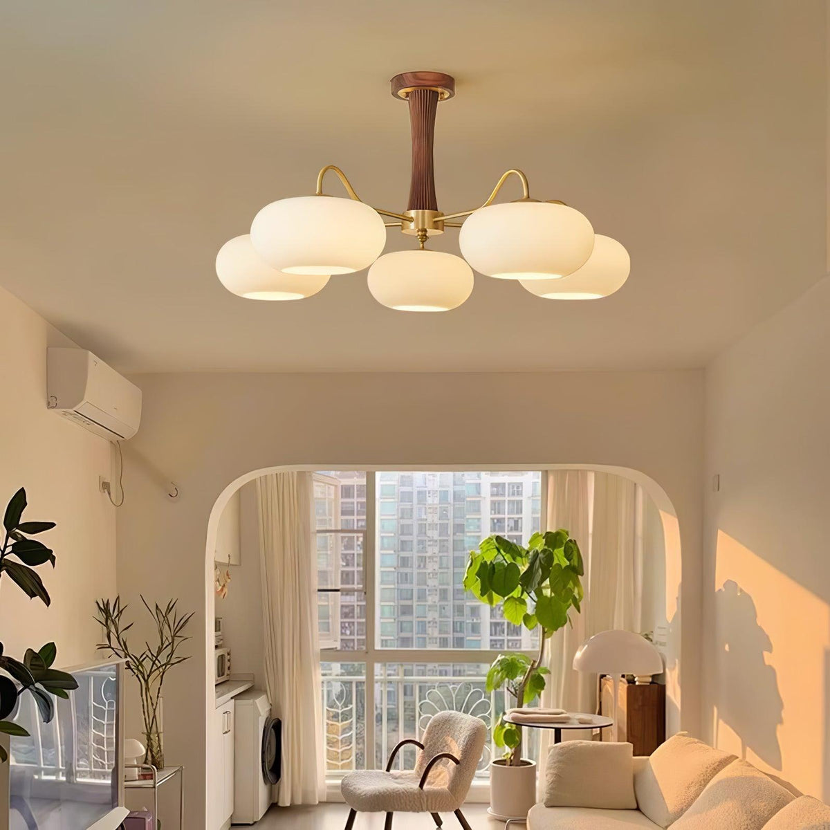 Persimmon glass chandelier with brass arms and wood-accent canopy in living room on Tampa Home & Garden Store