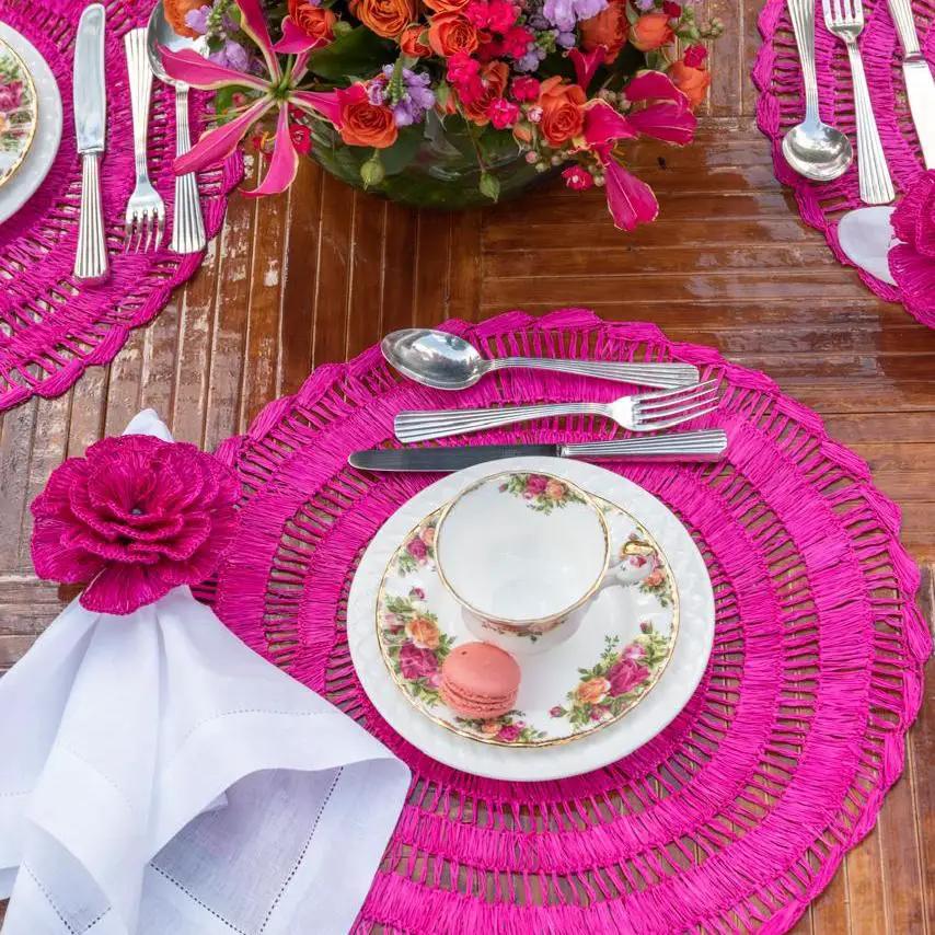 Buriti straw placemats vibrant pink with floral china place setting handcrafted by Talah Home on Tampa Home & Garden Store
