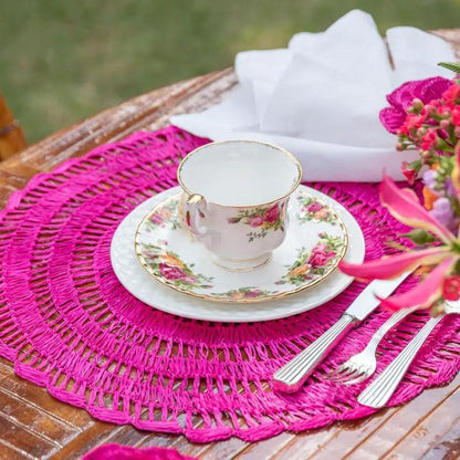 Buriti straw placemats pink round by Talah Home, handcrafted sustainable dining decor on Tampa Home & Garden Store