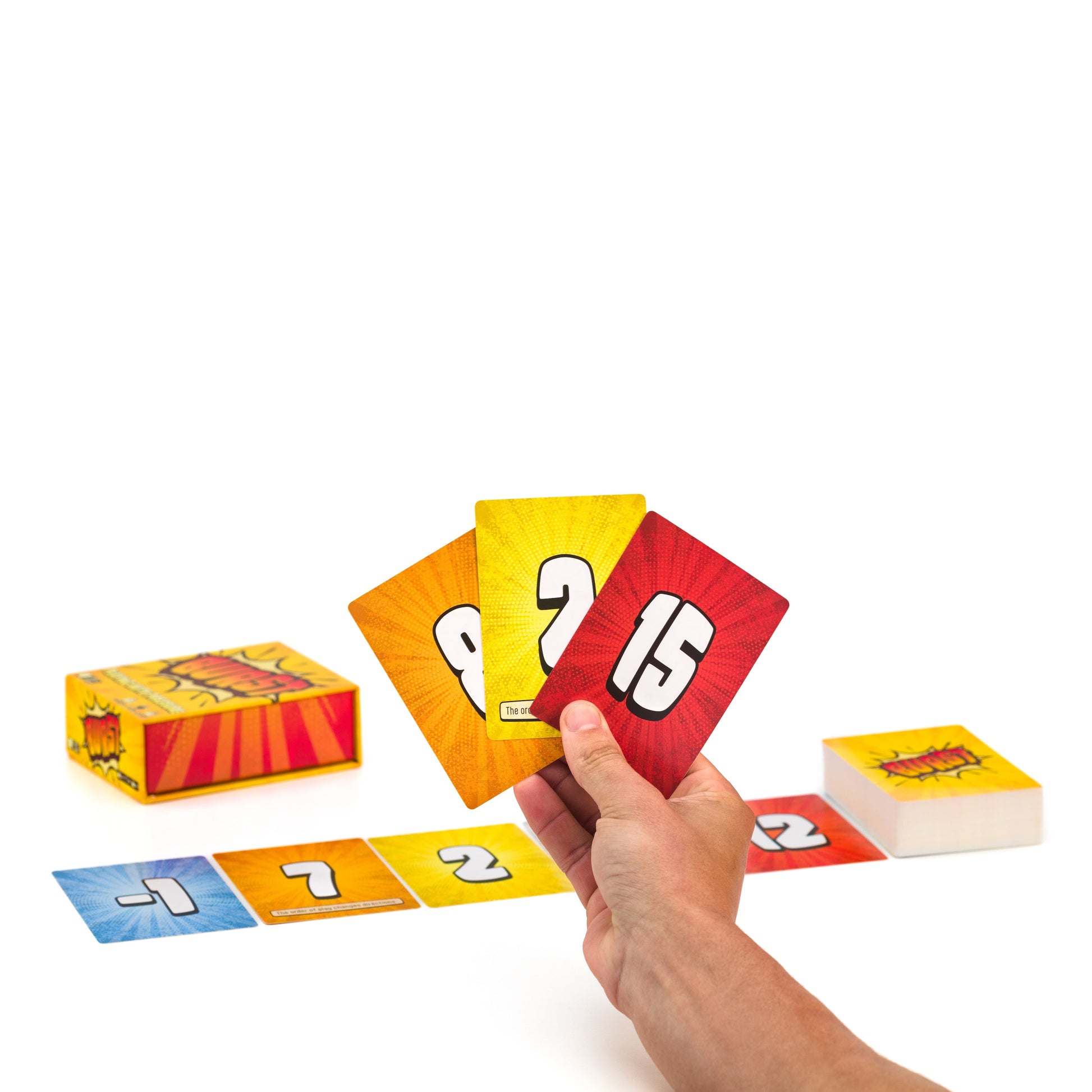 Burst card game by Lost Boy Entertainment, bright orange-yellow action cards held in hand on Tampa Home & Garden Store