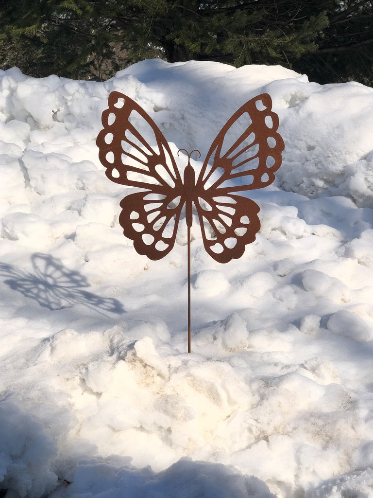 Rust-colored butterfly garden stake metal sculpture by Rustica Ornamentals for garden display on Tampa Home & Garden Store