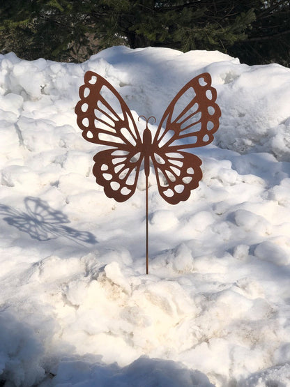 Rust-colored butterfly garden stake metal sculpture by Rustica Ornamentals for garden display on Tampa Home & Garden Store