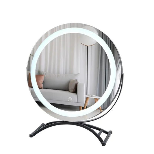 Round black dressing table mirror with LED ring light on curved black stand on Tampa Home & Garden Store