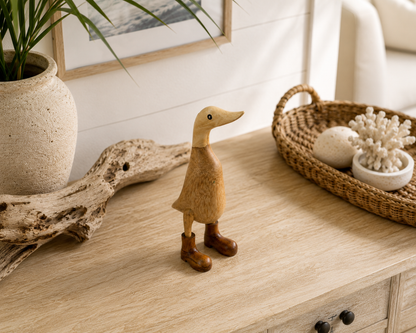Bali hand-carved bamboo duck sculpture in natural wood finish with brown boots on Tampa Home & Garden Store